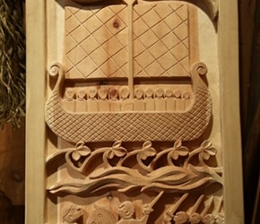 Wood carving Inside Long House at Lofotr Museum