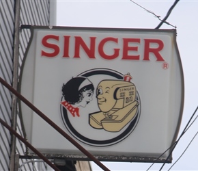 Antique Singer sewing machine advertisement at Elizabeth City