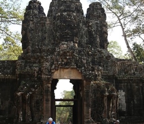 Chris Colyer exits entrance gate in Angkor Wat Complex