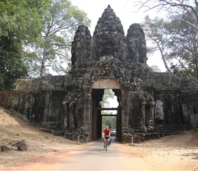 Neil exits entrance gate in Angkor Wat complex