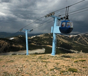 Descending the chair lift having been carried to the absolute summit of Monarch Mountain