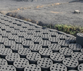 Coal firing blocks. Made by the roadside, they were produced in a press and left to dry in the sun