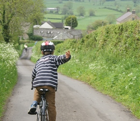 Edward  descends towards Glastonbury Tor from Wells, along Sustrans route