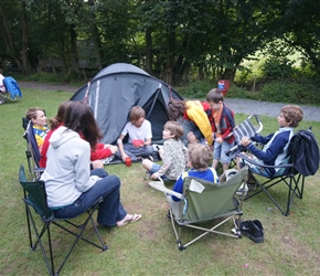 The younger members congregate around Dans tent