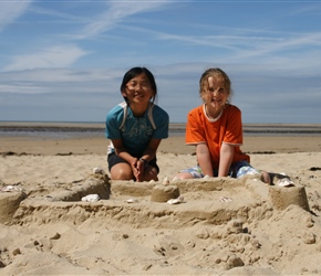 Kate and Louise with their sandcastle