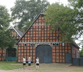 Nigel, Gilly and Emma admire the barn. Built round a village green there were maybe 10 of these