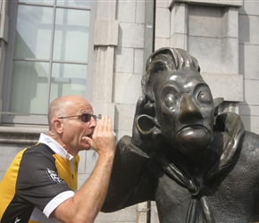 Lester whispers to the statue