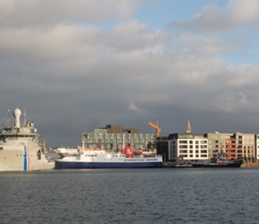 Reykjavík harbour at sunset. Cruise liners and naval boats jostle with sightseeing whaling boats