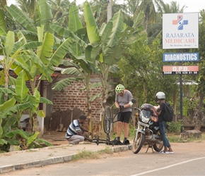 Mike had a puncture about 15km from Anuradhapura. These are such friendly people that the this chap stopped and started to help, pumping the inner tube and popping the tyre back on. I bought his son an ice cream who was so polite he wouldn't eat it, 