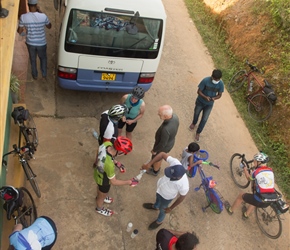 Early morning preparation for the day ahead.Water bottles filled, bikes checked in the shadow of the back up bus