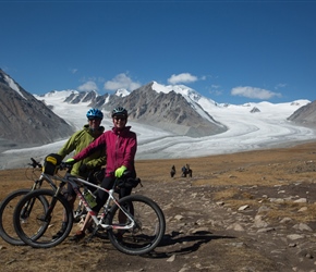 Peter and Claire in front of Khüiten Peak and glacier