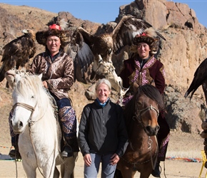 Sharon with a pair of eagle hunters on horseback