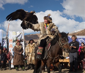 The winner of the 'mounted' eagle hunter leaves the prize giving area