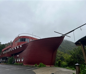 About 3km before Hiwasa on the descent lived a most unique boat shaped building