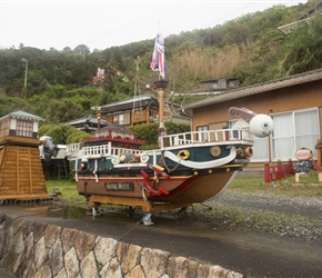 We passed this ship by the edge of the road. The owner looked on hanging a flag whilst we snapped away