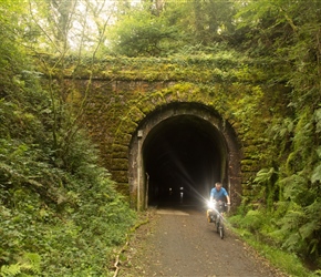 Andy exits a tunnel on the Plym Valley Cycleway