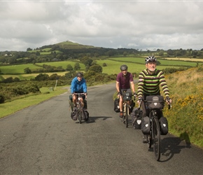 Dave, Will and Simon on the final stretch across Dartmoor with Brentor Church behind
