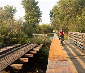 Sharon crosses railway trestle